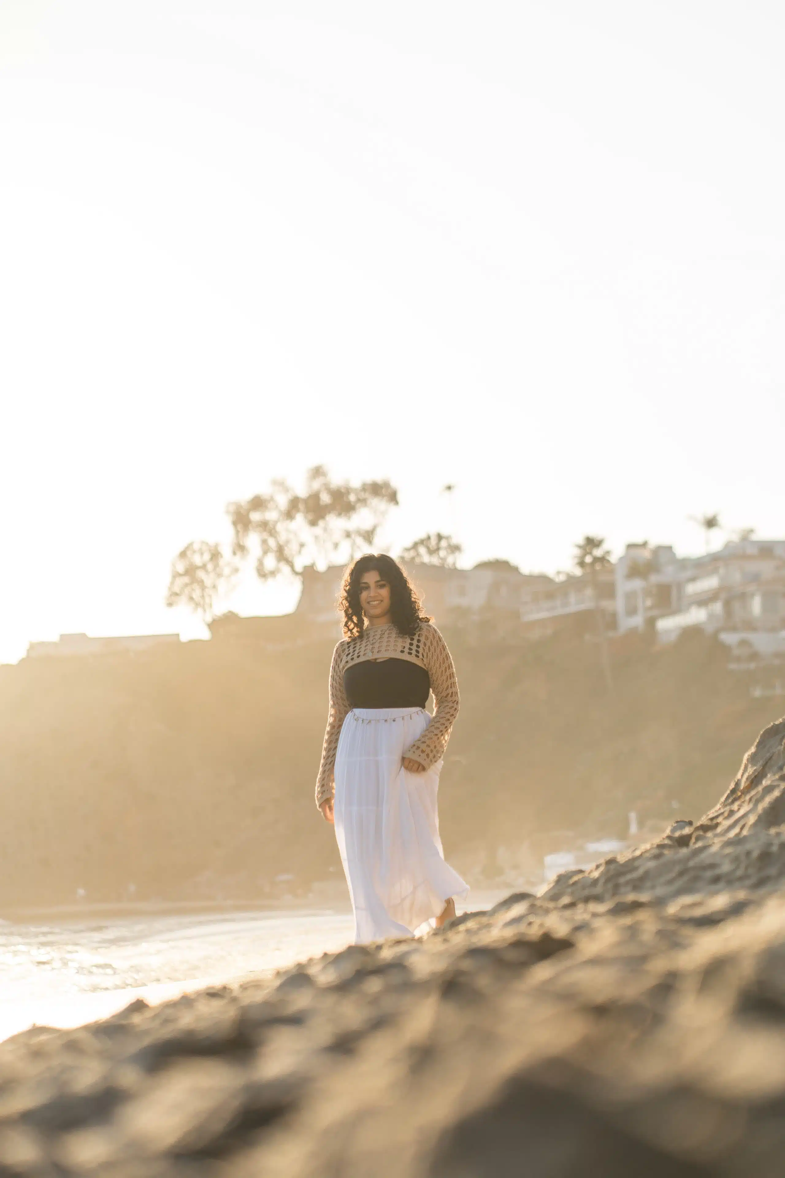 Graduate celebrating outdoors on a Southern California campus