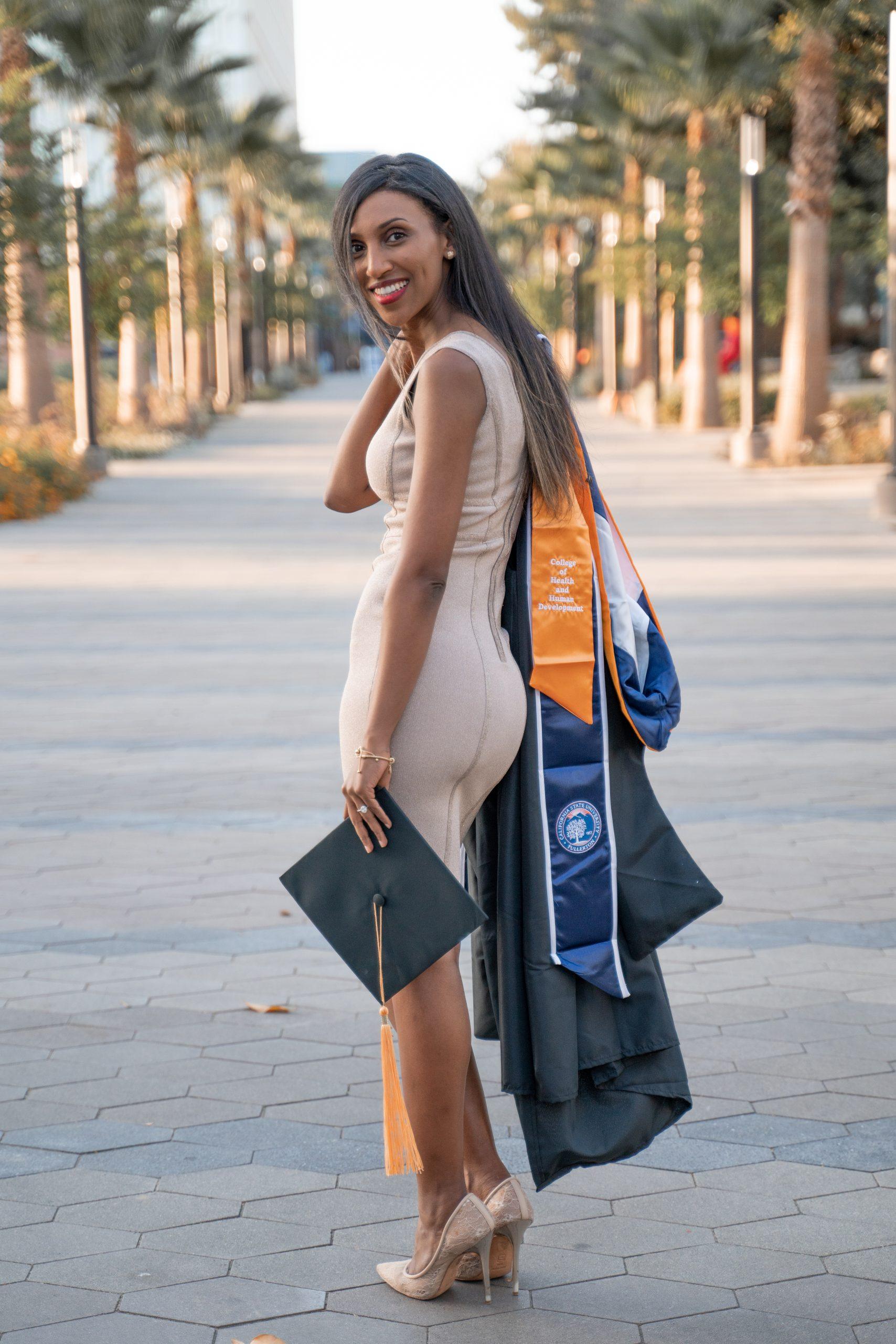 Graduation portrait near university campus architecture
