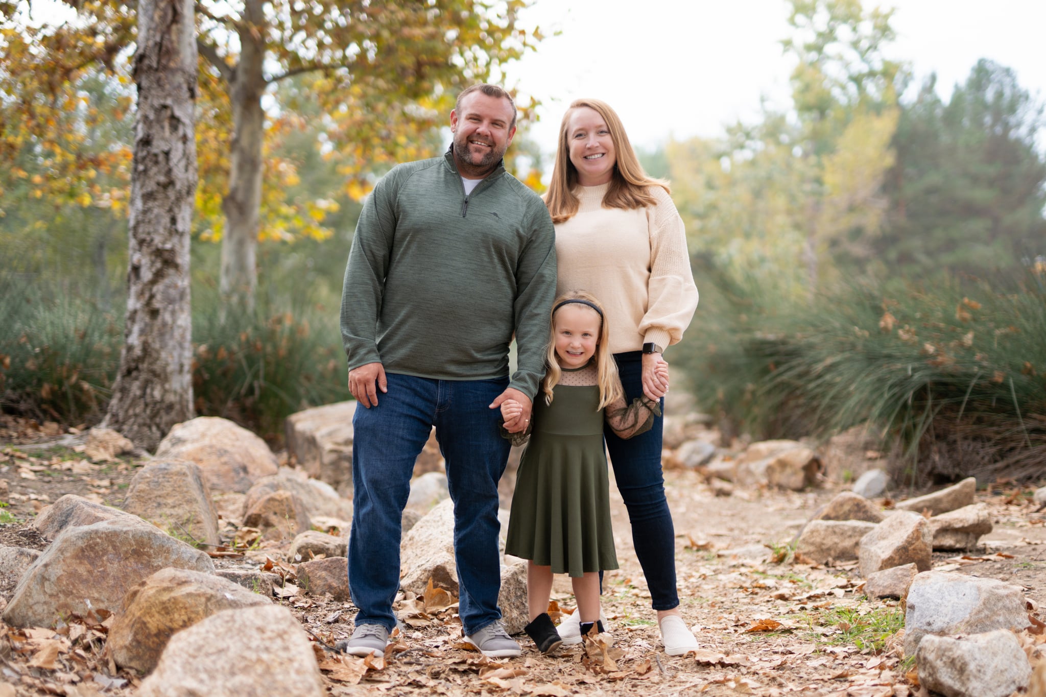 Family standing on the rocky path at Jeffrey Open Space Trail
