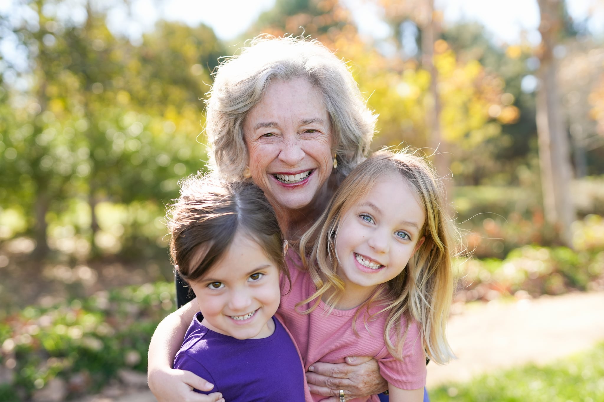 Grandmother hugging grandchildren at Jeffrey Open Space Trail