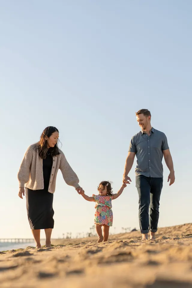 Family walking on the beach in Orange County